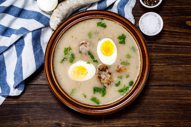 istock Sour rye soup on wooden table 1130934815