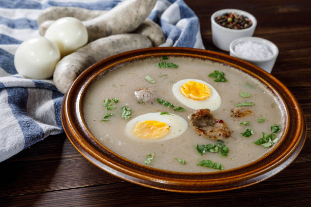 istock Sour rye soup on wooden table 1130934905