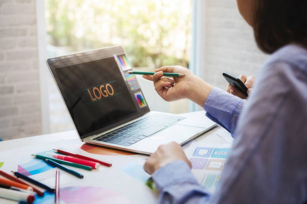 istock Designers working with color swatch samples for design web in workplace at office. ideas style networking concept. 1130936462