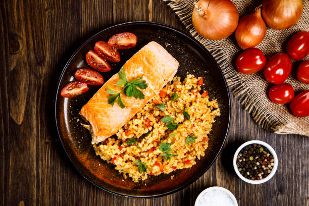 istock Grilled salmon with groats and vegetables 1130938287