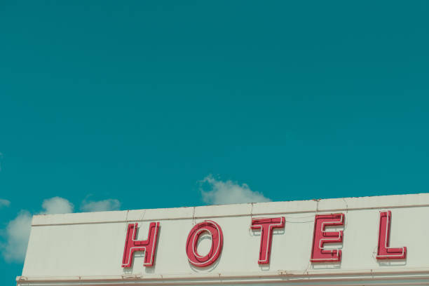 istock Hotel vintage neon sign text on old building 1130941471