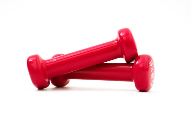 istock Two pink dumbbells isolated on white background 1130943044