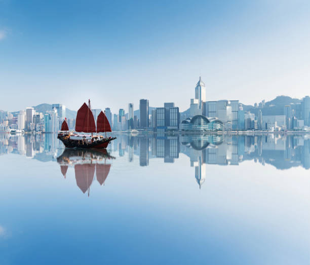 Junk boat crossing Hong Kong harbor.