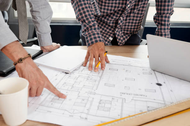 istock Building blueprint in tablet of construction engineers 1130945050