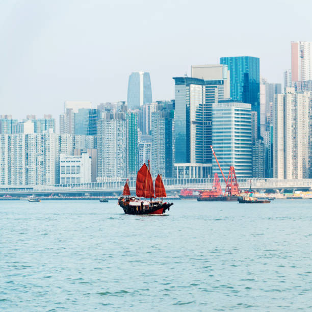 istock Junk boat crossing Hong Kong harbor 1130945473