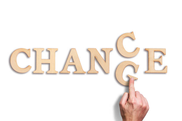 istock hand moving a letter, turning the word 
