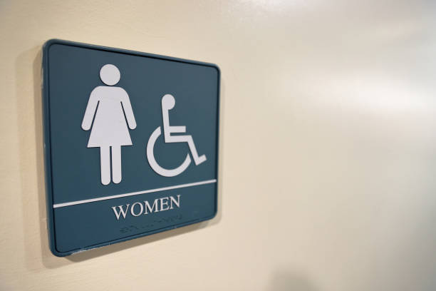 istock Bathroom sign on wall in building with copy space 1130945717
