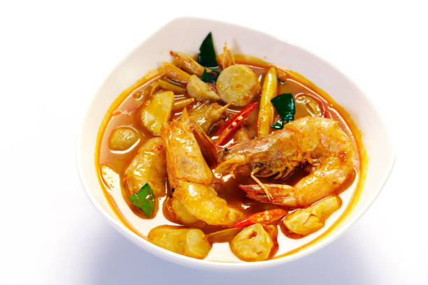 istock Tomyum shrimp with lemon on white background 1130947455