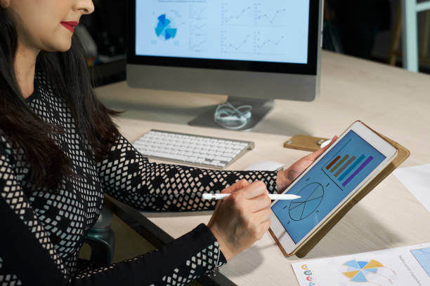 istock Businesswoman analyzing financial chart 1130947702