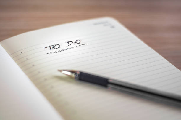 istock Notebook with a To Do title written by hand and a black pen 1130952986