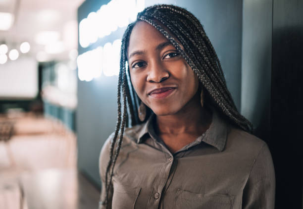 portrait of a beautiful young black african student with long braided hair - braided braids women long hair imagens e fotografias de stock