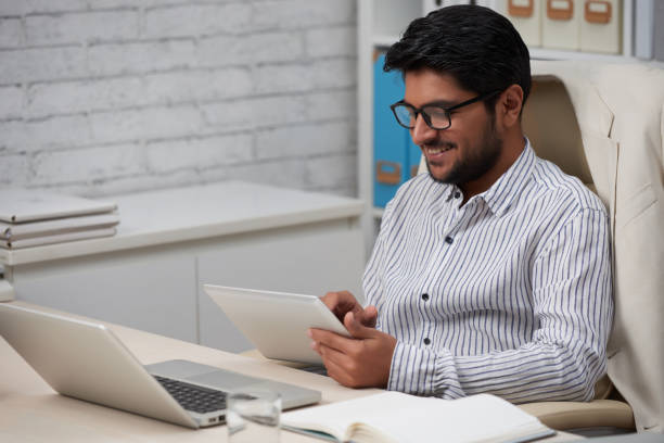 istock Happy businessman with digital tablet 1130953529