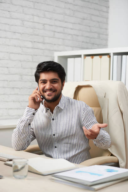 istock Cheerful business executive in office 1130953542