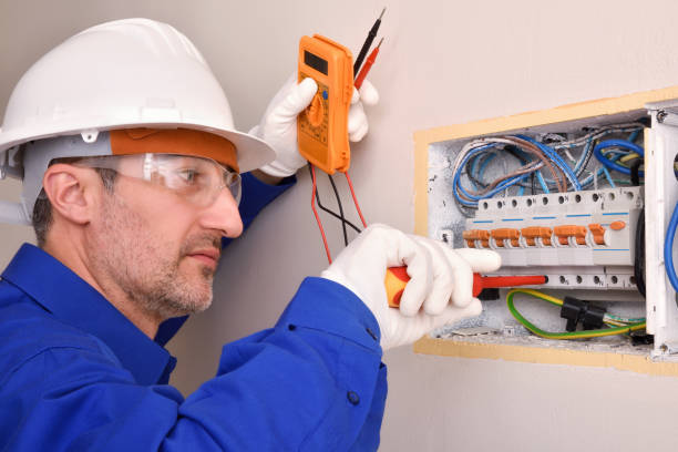 istock Electrical installer housing working in an electrical panel of house 1130957278