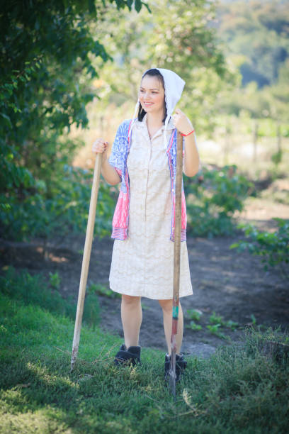 istock Young women working in her vegetable garden. 1130961746