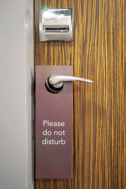 istock hotel door with the inscription does not disturb 1130965284