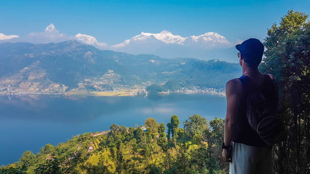 istock Nepal - Man Looking at the Pokhara Lake from above 1130965290