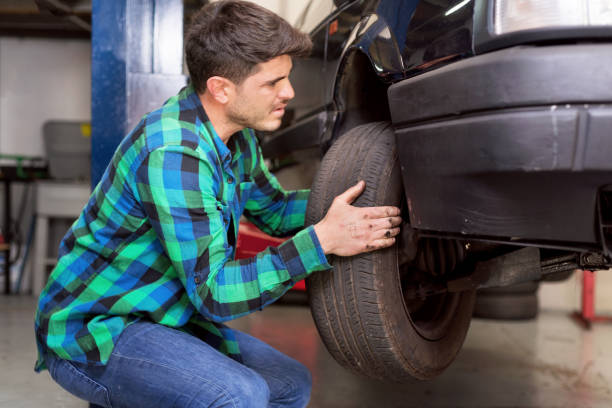 istock Mecanic checking car suspension system, at repair service station. 1130966906