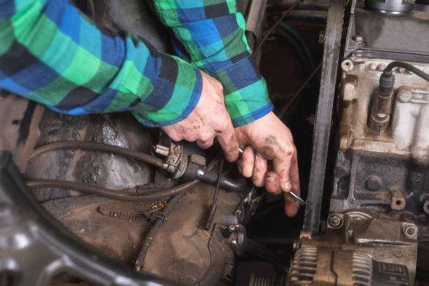 istock Mechanic repairing the engine. Checking auxiliary belt. 1130967104