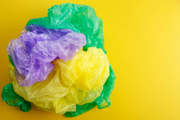 istock bag garbage, Trash, Garbage, Rubbish, Plastic Bags isolated on yellow background 1130967841