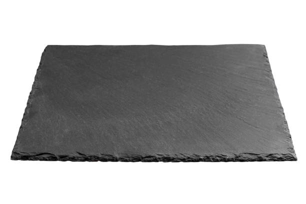 istock Empty black square slate plate isolated on white background. slate board isolated 1130968258