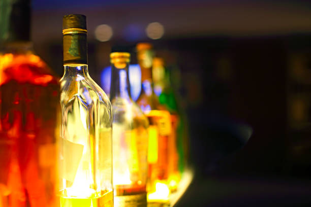 istock Bar counter with bottles in blurred background 1130968632