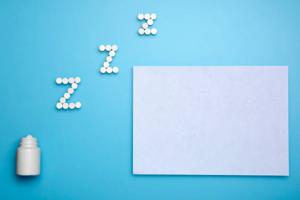 istock Pills. White tablets for Z shape. Z shape medicine pills on the light blue background. Copy space. Horizontal arrangement 1130972439