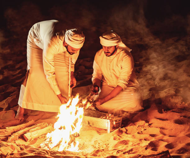 istock Arab Friends Enjoying Bonfire at a Desert Camp 1130972846