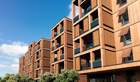 A large modern development of luxury flats in Auckland, New Zealand, with a hardwood facade.