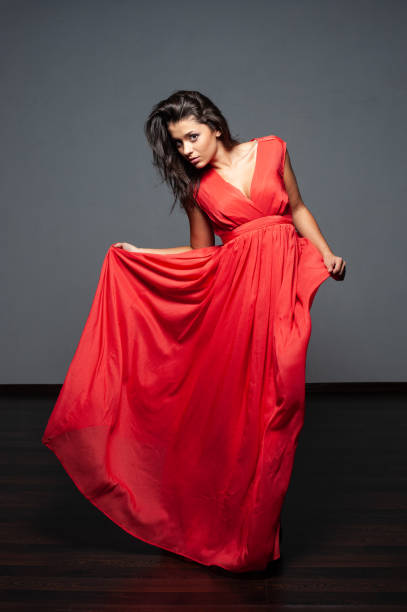 istock a woman in a red dress 1130974176