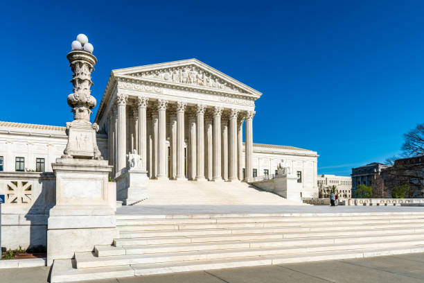 Justice at the United States Supreme Court The United States Supreme Court Building in Washington D.C. supreme court stock pictures, royalty-free photos & images