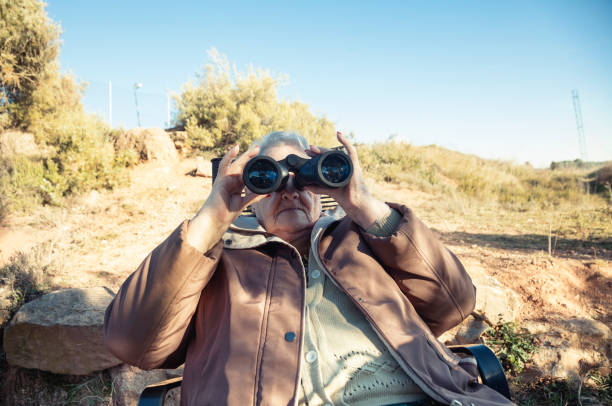 istock Senior woman Birdwatching 1130976376