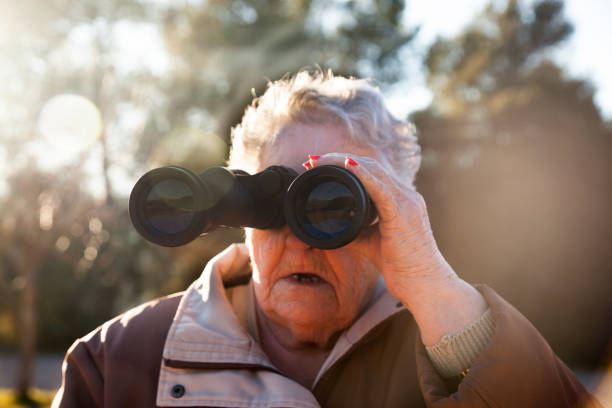istock Senior woman Birdwatching 1130976388