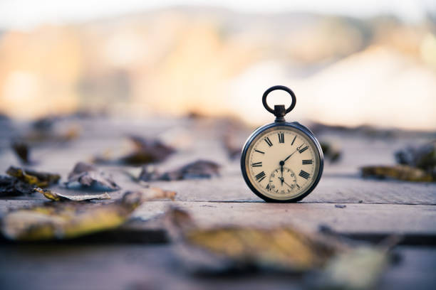 istock Hand held stop watch outdoors, autumn, blurry background 1130982562