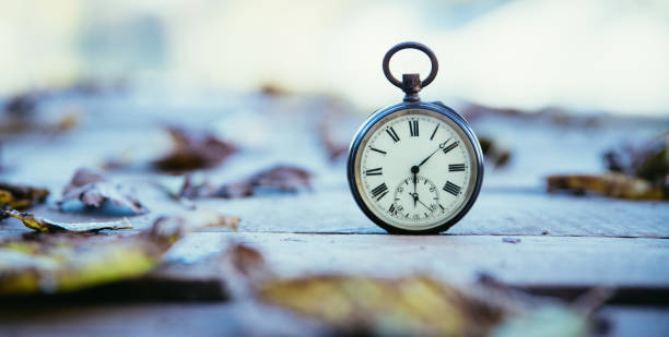 istock Hand held stop watch outdoors, autumn, blurry background 1130982564