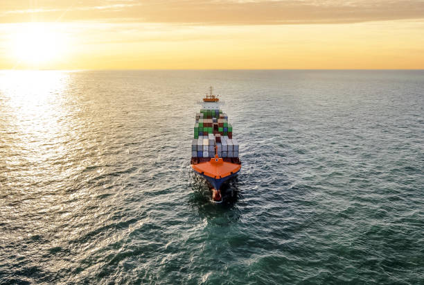 istock Aerial view of a cargo ship at dawn 1130984503