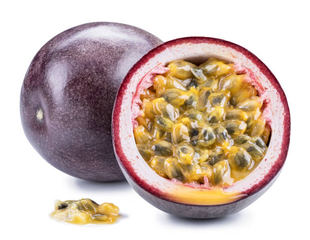 istock Passion fruit and its cross section with pulpy juice filled with seeds. 1130984669