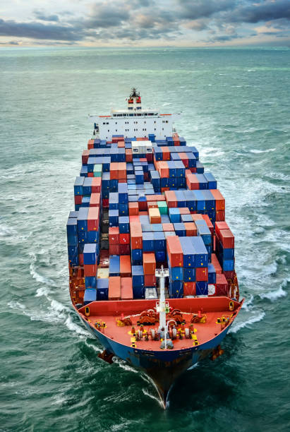 istock Aerial view of a cargo ship at dawn 1130984740