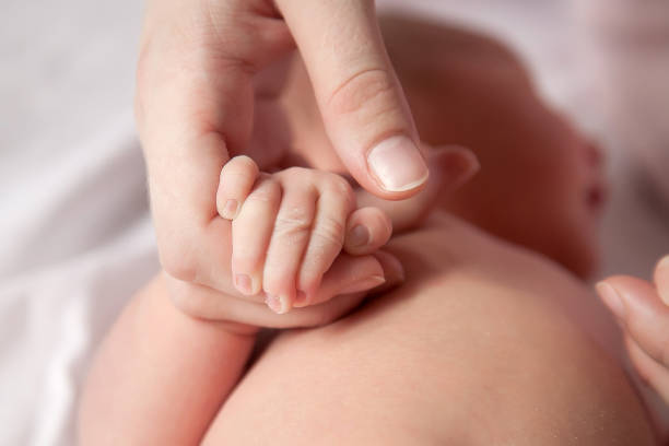 istock The baby is holding Mom's hand 1130984765