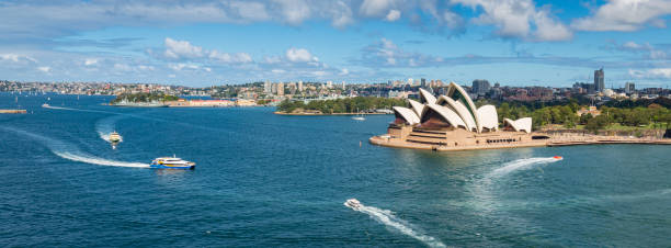 sydney opera house in and boats in the harbour sydney, australia - sydney opera house sydney australia australia opera house imagens e fotografias de stock