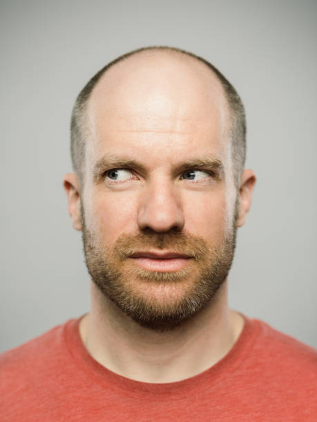 istock Real caucasian man with blank expression looking to the side 1130989125