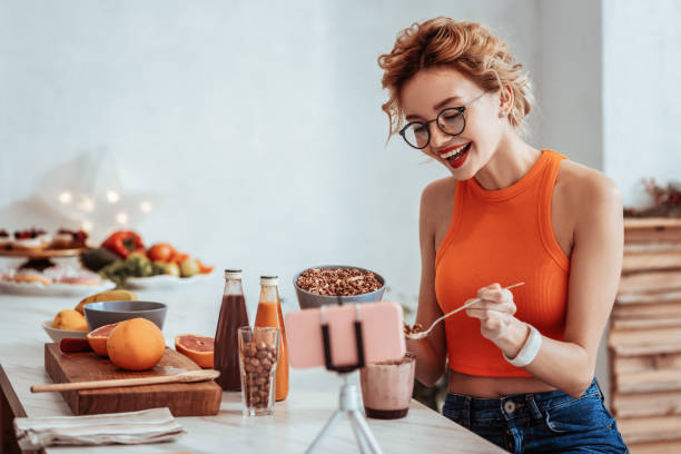 istock Joyful positive woman having a healthy breakfast 1130990664