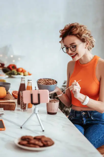 Photo of Nice joyful woman enjoying her tasty meal