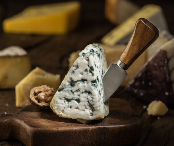 istock Segment of blue mould cheese and cheese knife. 1130991249