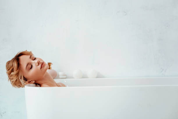 istock Nice relaxed woman enjoying her hot bath 1130992816