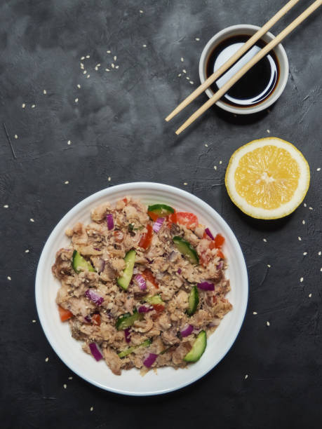 istock Asian Tuna Salad on the black table. Top view. 1130993572