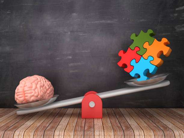 istock Seesaw Scale with Human Brain and Puzzle on Chalkboard Background - 3D Rendering 1130994479