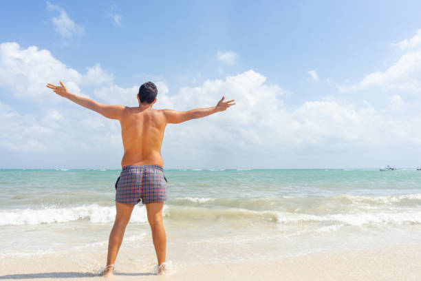 istock Young man looking the sea 1130994595