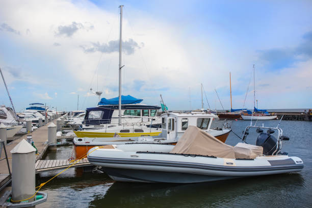 istock Sailing yachts and powerboats 1130995094