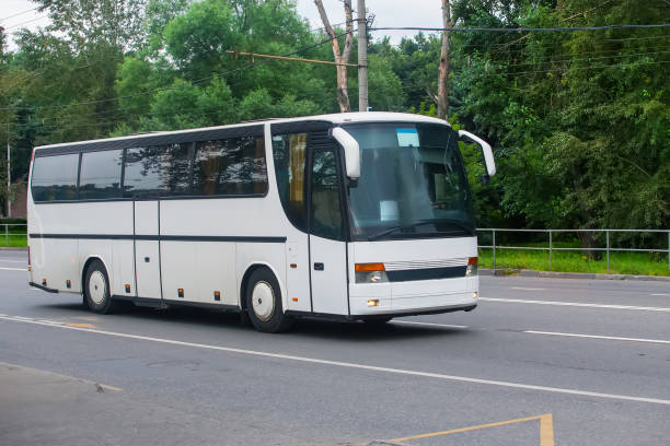 istock tourist bus rides on the highway 1130995176